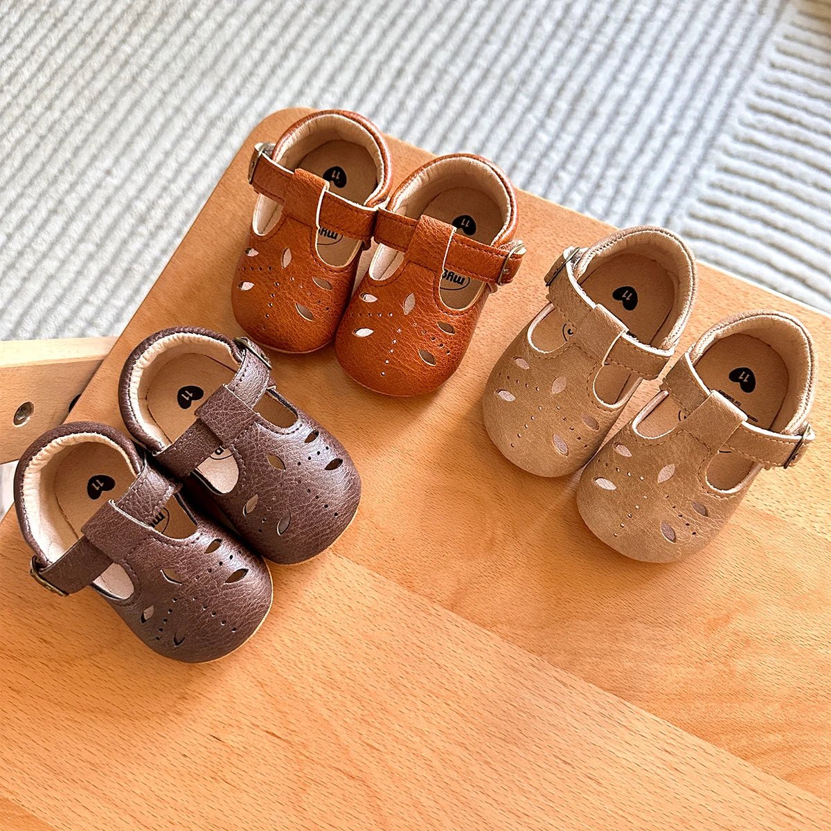 Baby T-strap shoes in several colours arranged together, second view