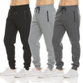 Three pairs of drawstring jogger sweatpants in black and two greys with zip pockets, front view