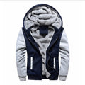 Navy hooded zip jacket with light grey sleeves, zip pockets and a fluffy-looking lining