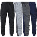 Four pairs of drawstring jogger sweatpants in black, light grey, dark grey and navy side by side