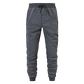Dark grey drawstring jogger sweatpants with side pockets and ribbed ankle cuffs, front view