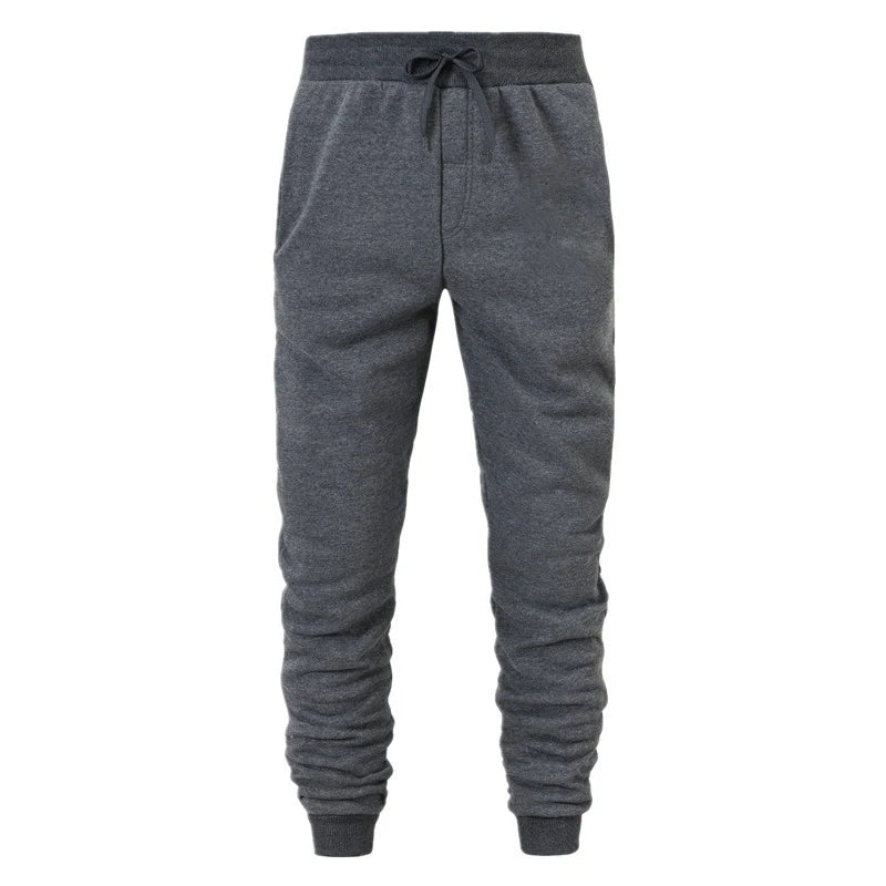 Dark grey drawstring jogger sweatpants with side pockets and ribbed ankle cuffs, front view
