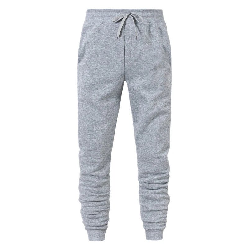 Light grey drawstring jogger sweatpants with side pockets and ribbed ankle cuffs, front view