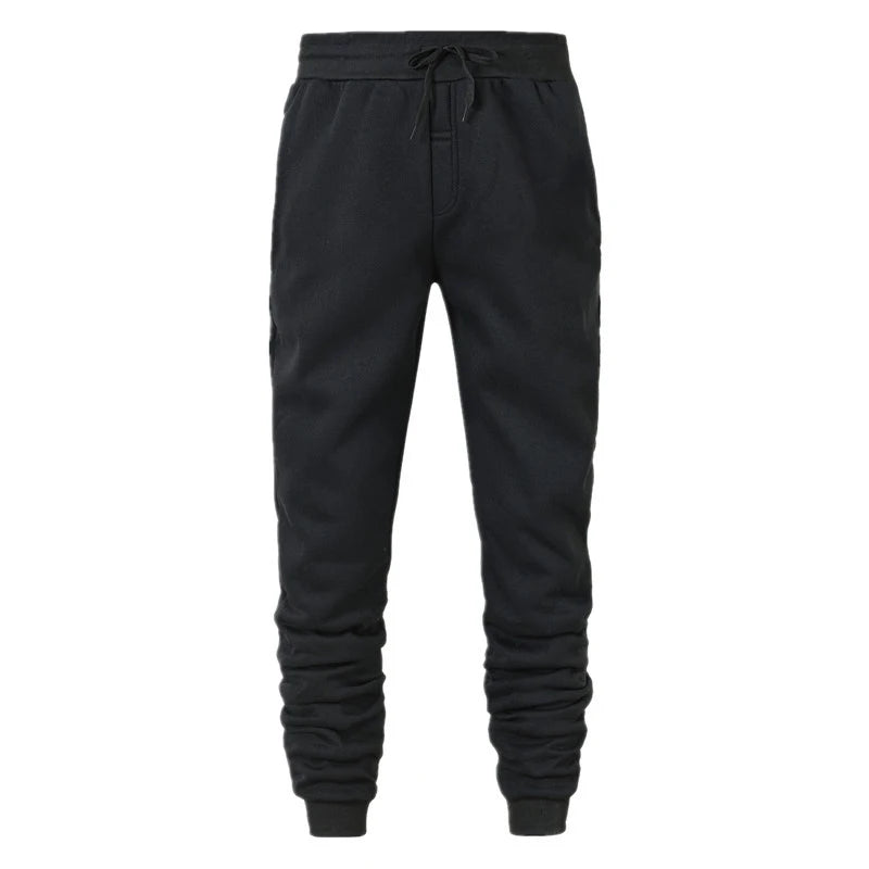 Black drawstring jogger sweatpants with side pockets and ribbed ankle cuffs, front view
