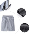 Light grey drawstring shorts with close-up circles showing the pocket and inner lining details