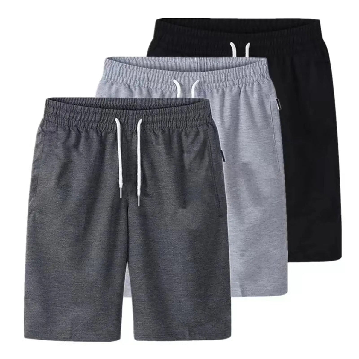 Stack of three drawstring shorts in dark grey, light grey and black shown together