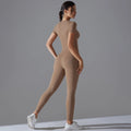 Side-back view of a woman in a tan short-sleeve top and matching full-length leggings