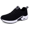 Black knit lace-up sneaker with a white cushioned sole, side view on a white background