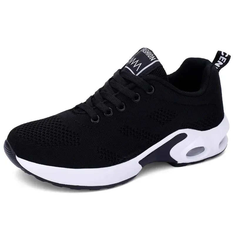 Black knit lace-up sneaker with a white cushioned sole, side view on a white background