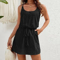 Woman in a black eyelet sleeveless mini dress with a drawstring waist, black colour option