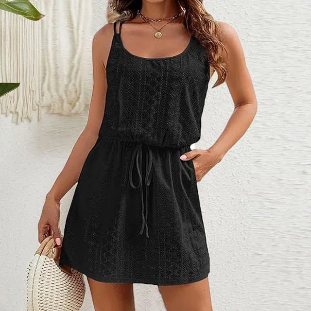 Woman in a black eyelet sleeveless mini dress with a drawstring waist, black colour option