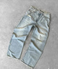 Light blue washed baggy wide-leg jeans with a raw frayed hem laid flat