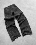 Black washed baggy straight-leg jeans with frayed thread-line texture, front view