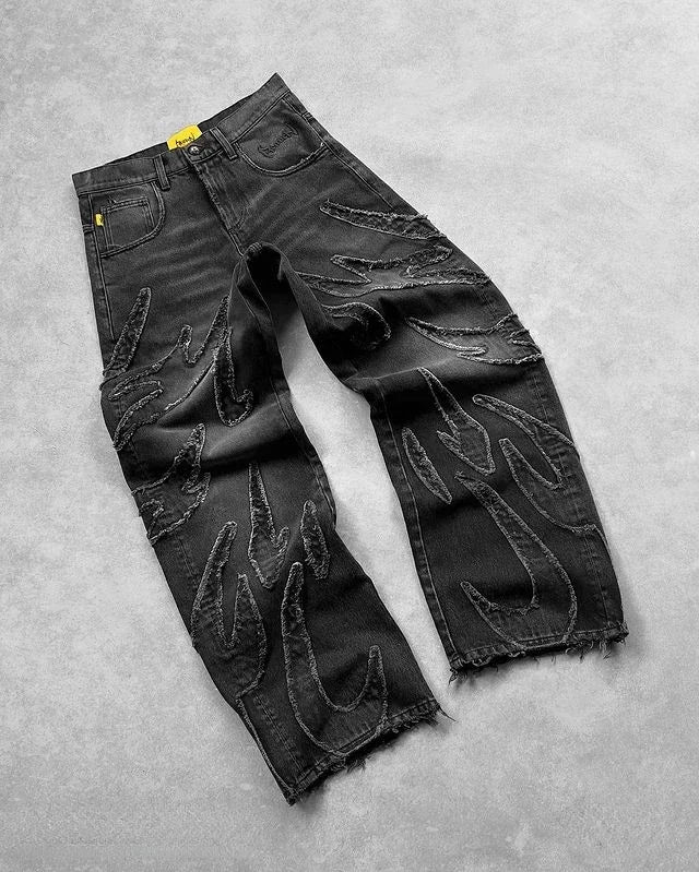 Black washed baggy wide-leg jeans with frayed thread lines and a raw hem